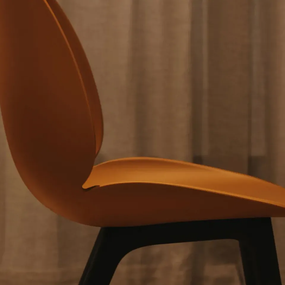 GUBI Chairs*Beetle Plastic chair, Amber , black leg Brown