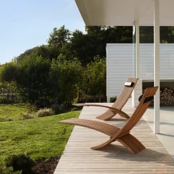Skargaarden Seating*Nozib lounge chair, Teak, black neck rest in leather Brown