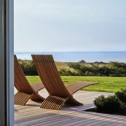 Skargaarden Seating*Nozib lounge chair, Teak, black neck rest in leather Brown